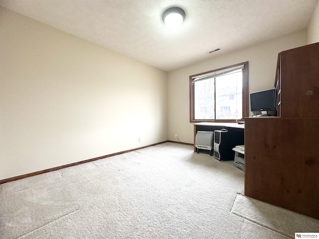 unfurnished office with light colored carpet