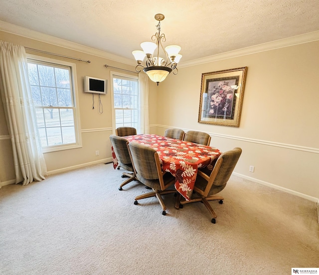 dining room with crown molding, light colored carpet, a chandelier, and a textured ceiling