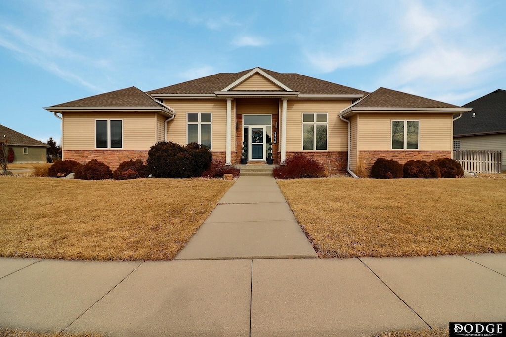 view of front of home with a front lawn