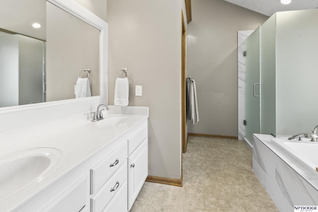 bathroom featuring shower with separate bathtub and vanity