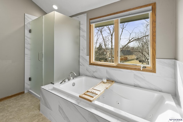 bathroom with shower with separate bathtub