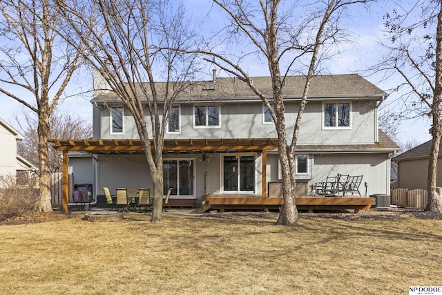 back of house featuring a wooden deck, a yard, and central AC unit