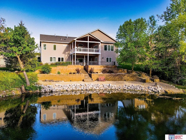 rear view of house with a water view