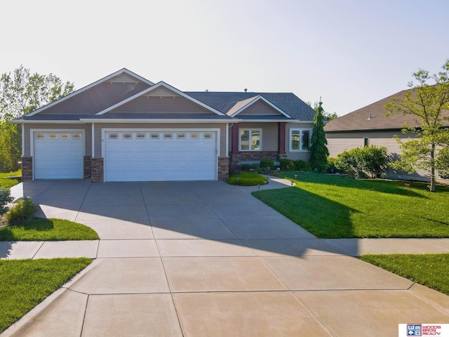 view of front of property featuring a garage and a front yard