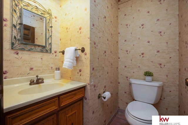 bathroom featuring vanity and toilet