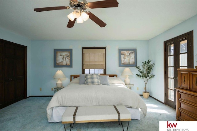 bedroom featuring ceiling fan and light carpet