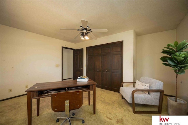 office space featuring light colored carpet and ceiling fan