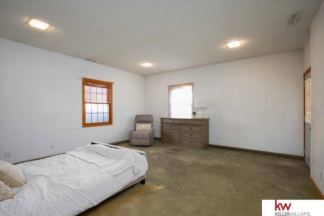 bedroom featuring dark carpet