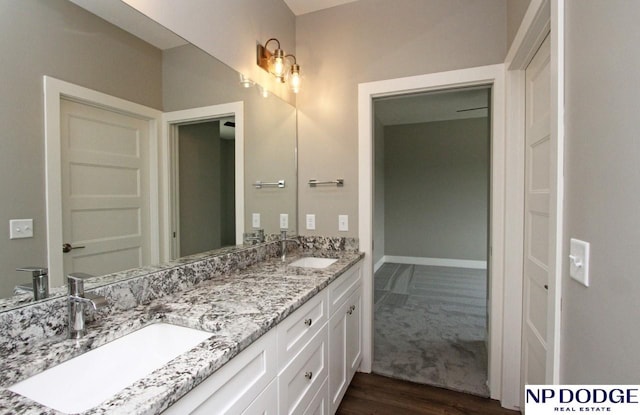 bathroom featuring vanity and wood-type flooring