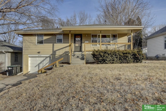 view of front of house featuring a garage and covered porch