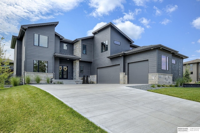 view of front facade with a garage and a front yard