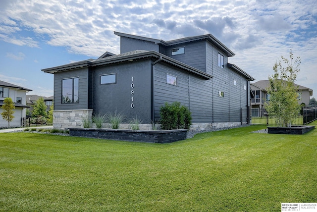 view of home's exterior with a yard