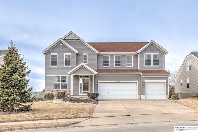 view of front of property featuring a garage