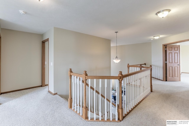 hallway with light carpet