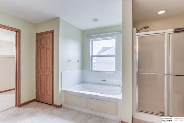 bathroom featuring separate shower and tub