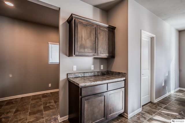 kitchen featuring dark brown cabinets