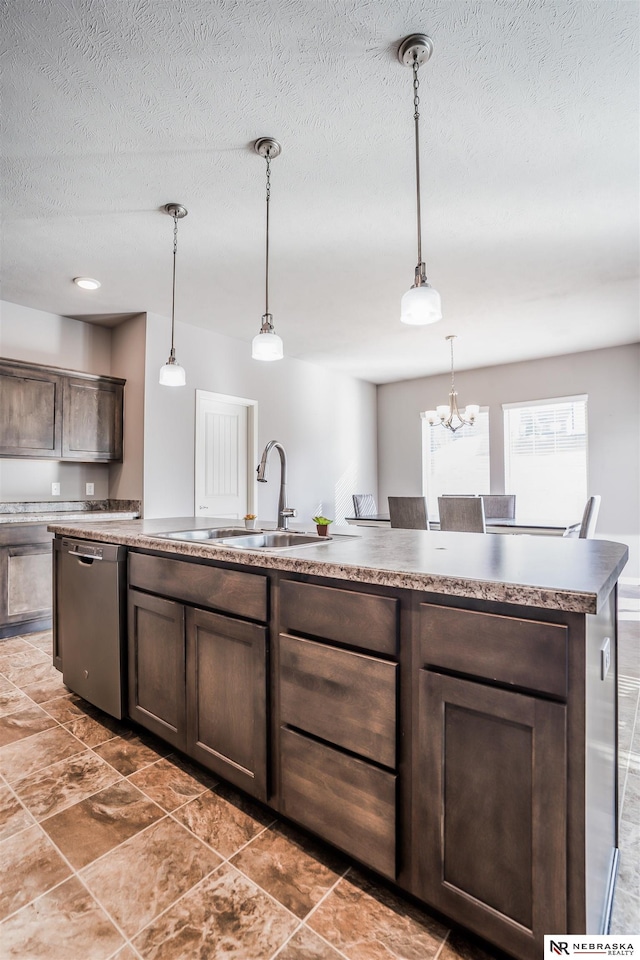 kitchen with dark brown cabinetry, dishwasher, sink, and hanging light fixtures