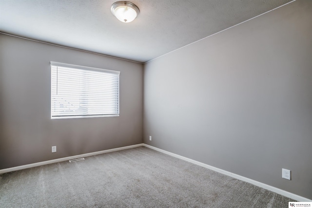 unfurnished room featuring carpet floors