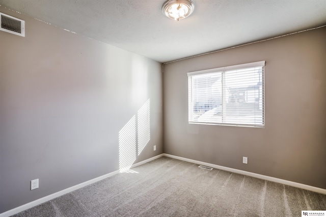 unfurnished room with carpet