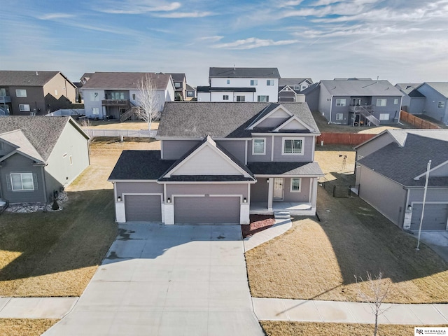 view of front of house featuring a garage and a front yard