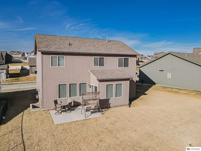 rear view of house with a patio