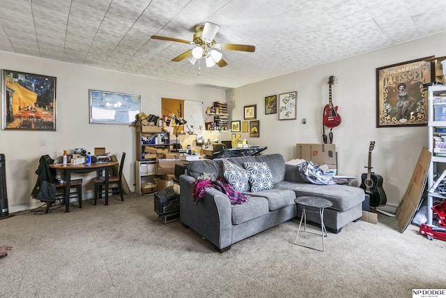 living room featuring carpet flooring and ceiling fan