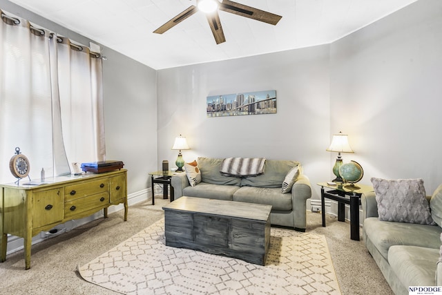 living room featuring ceiling fan and light colored carpet