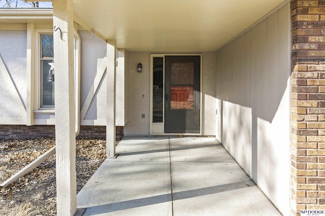 doorway to property featuring a patio