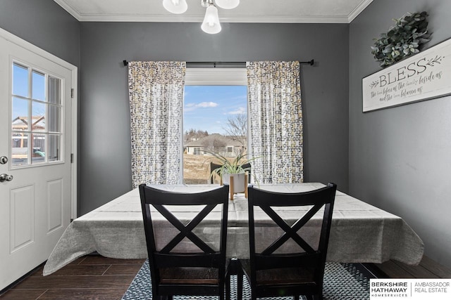 dining area with ornamental molding and a healthy amount of sunlight