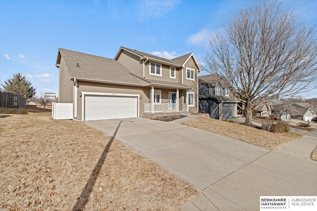 front of property with a porch and a garage