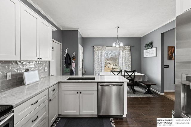 kitchen with appliances with stainless steel finishes, white cabinets, a chandelier, kitchen peninsula, and light stone countertops