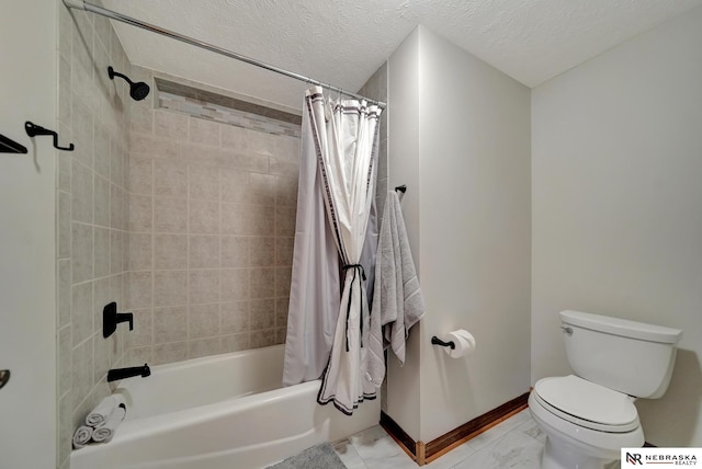 bathroom featuring toilet, a textured ceiling, and shower / bath combo with shower curtain