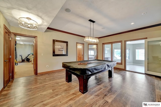 playroom featuring pool table, ornamental molding, and light wood-type flooring