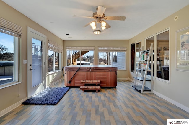 interior space with hardwood / wood-style flooring and ceiling fan