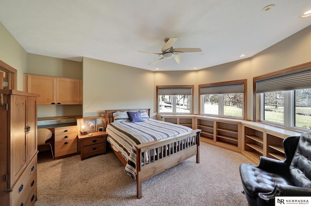 bedroom featuring ceiling fan and light colored carpet