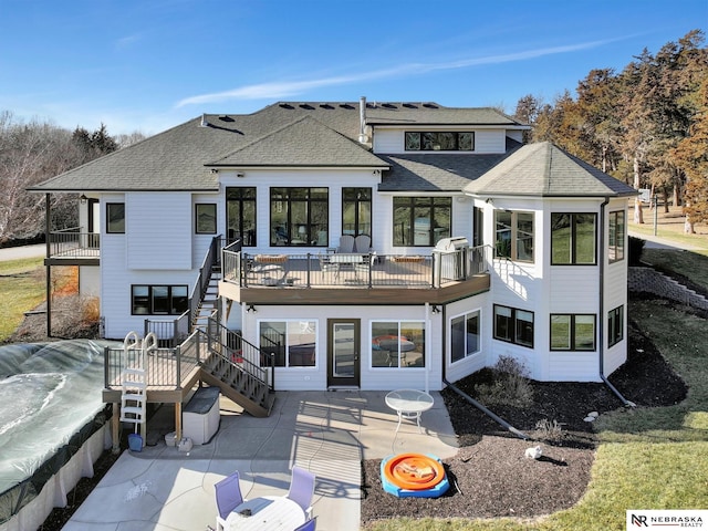 rear view of house featuring a patio