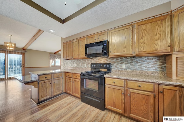 kitchen featuring decorative light fixtures, black appliances, backsplash, kitchen peninsula, and light hardwood / wood-style flooring