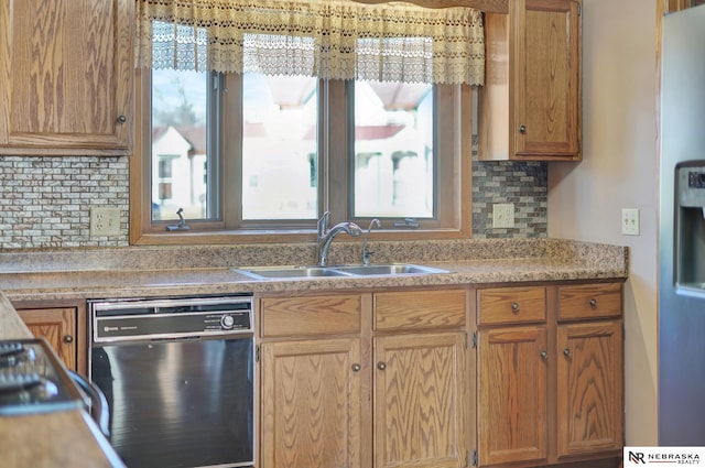 kitchen with tasteful backsplash, black dishwasher, and sink