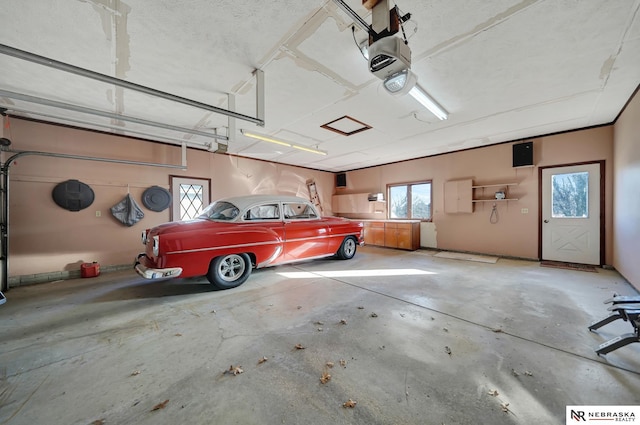 garage featuring a garage door opener