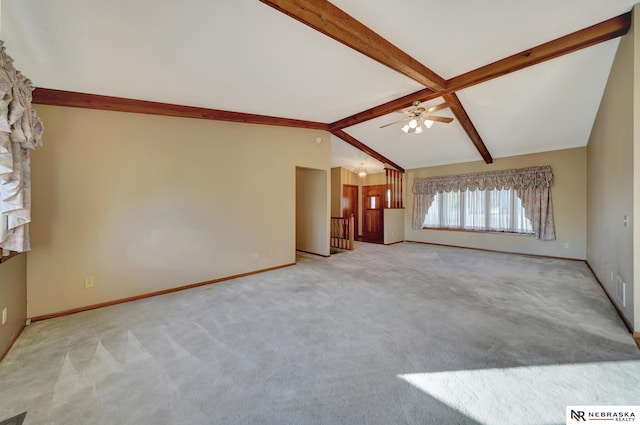 unfurnished living room featuring lofted ceiling with beams, light carpet, and ceiling fan