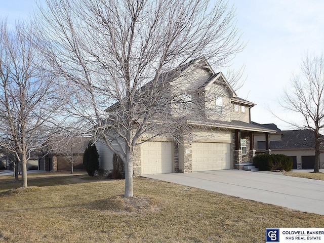 view of side of home with a garage and a lawn