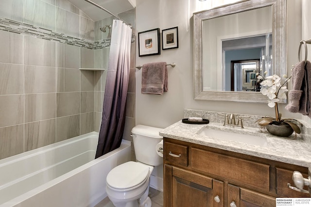 full bathroom featuring vanity, shower / tub combo with curtain, and toilet