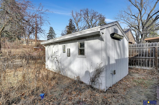 view of side of property with an outbuilding