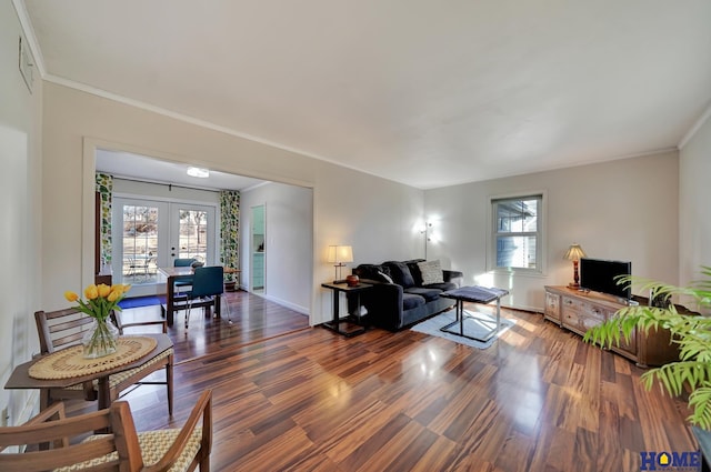 living room with french doors, plenty of natural light, and dark hardwood / wood-style floors