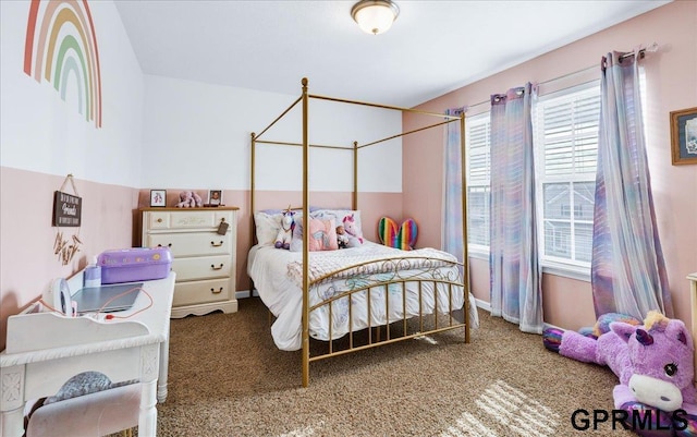 carpeted bedroom featuring multiple windows