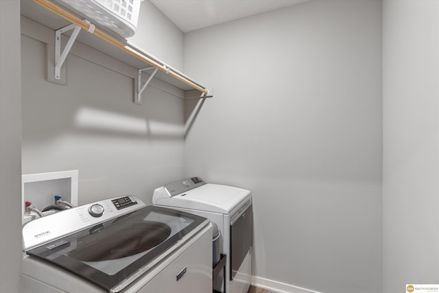 laundry area featuring separate washer and dryer