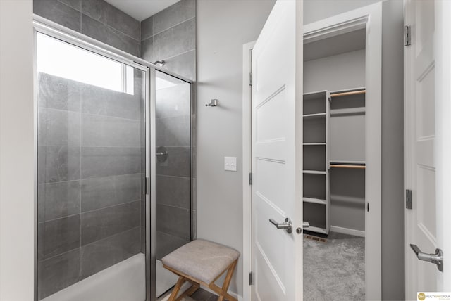 bathroom with a shower with shower door