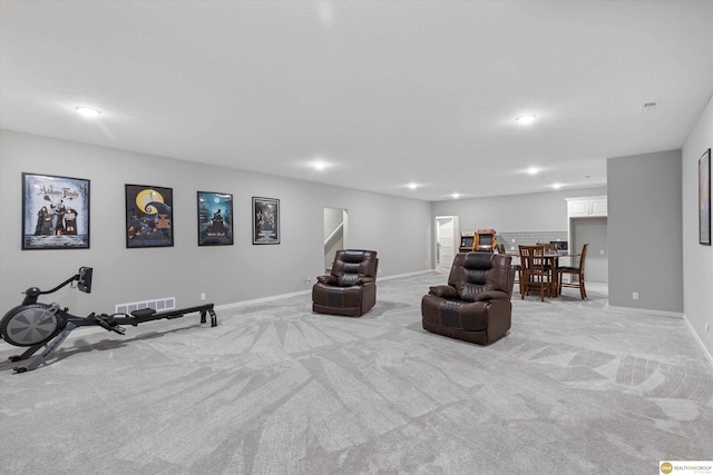 sitting room featuring light colored carpet