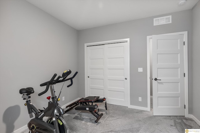 workout area with light colored carpet