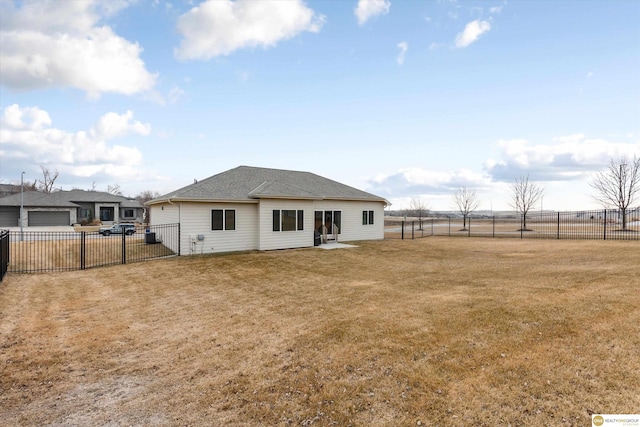 back of house with a yard